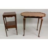 A 'Chippendale Revival' mahogany centre table, with shaped oval tray top, on slender cabriole legs,
