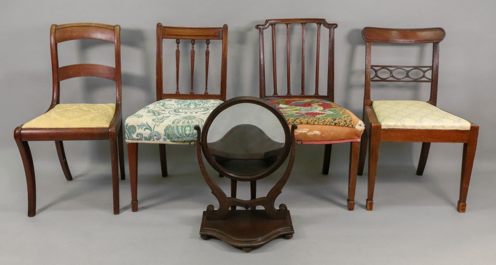 A late Victorian mahogany oval swing toilet mirror, with serpentine fronted plateau base,