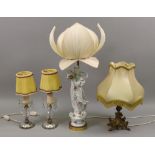 A modern Chinese porcelain figure of guanyin, mounted as a table lamp with lotus flower shade,