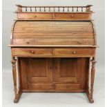 A reproduction late 19th century style hardwood cylinder font desk,