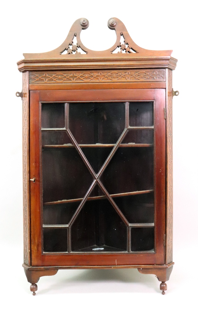 A 'Chippendale Revival' mahogany blind cut-card carved wall hanging corner cabinet,