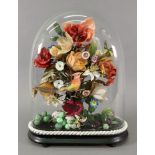 A pastiche of a Victorian flower arrangement, 20th century, with a bird and fruits,