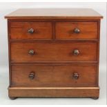 A Victorian mahogany chest, fitted with two short and two long drawers, on bun feet, 91.