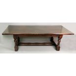 A reproduction 17th century style oak refectory table, with three plank top,