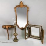 A reproduction mid 18th century style gilt frame wall mirror, of shaped outline,