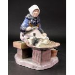 A Bing & Grondahl figure of a fisher woman, model no. 2233, 22cm high.