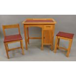 A child's Taylor light wood desk, 69cm wide x 38cm deep x 69cm high with matching chair and stool,