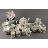A Minton Haddon Hall thirty-one piece tea service and eight Wedgwood Hathaway Rose coffee cans and