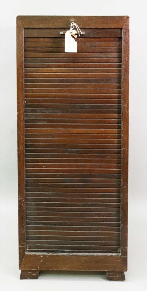 An oak filing cabinet,mid 20th century, the tambor shutter enclosing sliding trays, - Image 2 of 2