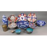A collection of eight Hizen Imari plates and dishes and a similar bowl,