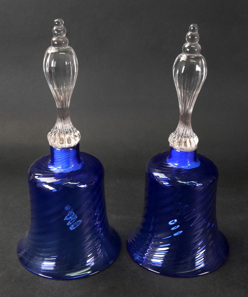 A pair of blue tinted glass bells, wryth