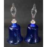 A pair of blue tinted glass bells, wryth