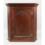 A George III oak wall hanging corner cab