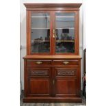 An Edwardian walnut bookcase, the upper