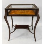 An Edwardian mahogany curio table, with