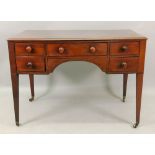 An early 19th century mahogany ebony banded dressing table,