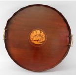 An Edwardian 'Sheraton Revival' mahogany circular two-handled gallery tray,