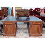 A large 19th century mahogany pedestal partners desk,