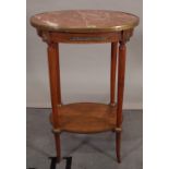 A 19th century French stained beech oval occasional table with inset marble top,