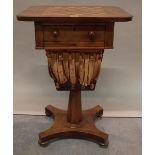 A Regency mahogany inlaid games table, 50cm wide x 74cm high.