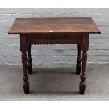 An 18th century oak side table, the cleated twin plank top over single drawer, on turned supports,