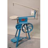 A 20th century "The Gem" treadle powered hobby saw, painted blue.