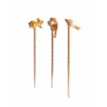 A gold and cultured pearl stick pin, modelled as a monkey, detailed 18, a cultured pearl stick pin,