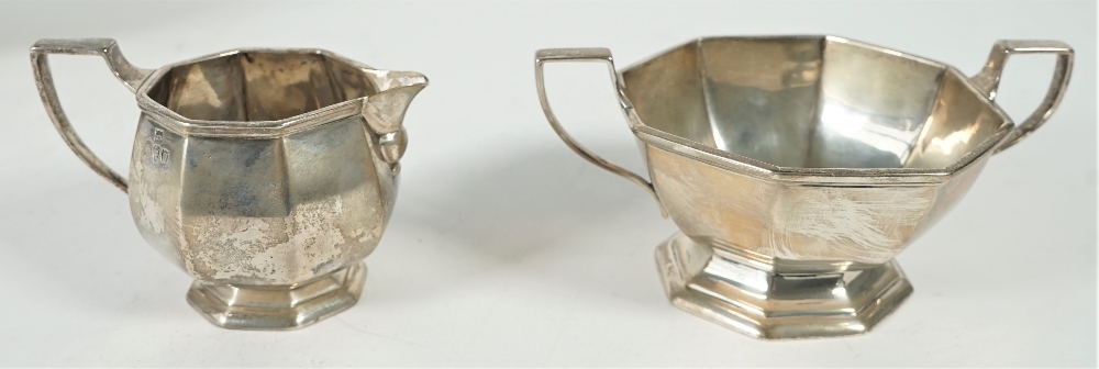 Silver tea wares, comprising; a teapot with a wooden handle, a twin handled sugar bowl, - Image 2 of 4