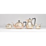 A silver four piece tea set, comprising; a teapot and a hot water jug,