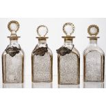 Four square glass decanters and stoppers, 19th century, each with gilt vermicule decoration,