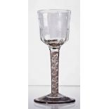 An opaque twist wine glass, circa 1765, the ogee bowl with vertical fluting,