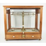 A mahogany cased brass and ivory mounted precision beam scale by L Oertling London,