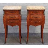 A pair of Louis XV style bedside tables, each with marble tops,