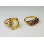 A 9ct gold and garnet five stone ring, Birmingham 1972, ring size Q and a gold ring,