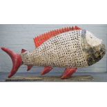A modern polychrome painted metal fish of large proportions,