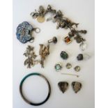 A group of jewellery, comprising; a charm bracelet, fitted with a variety of mostly silver charms,