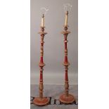 A pair of Regency style red and parcel gilt decorated standard lamps, 150cm high, (2).