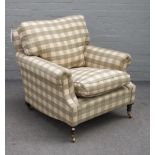 George Smith; a green checked upholstered easy armchair, on turned supports, 92cm wide x 81cm high.