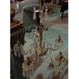 A gilt metal five branch chandelier with glass drops, 70cm high.