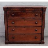 An early Victorian mahogany chest, with four long graduated drawers flanked by split turned columns,