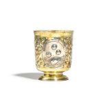 An 18th century Russian parcel gilt beaker, the body with three oval reserves, having Latin mottos,