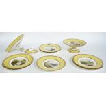 A Copeland porcelain part dessert service, painted with landscape scenes against a yellow ground,