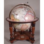 A 20th century table top globe, on stained beech stand, 52cm high.