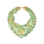 An Angela Pintaldi four row necklace of graduated varicoloured pale green hardstone beads,