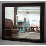 A large 19th century Dutch wall mirror with ebonised ripple frame and bevelled mirror plate,