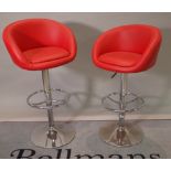 A pair of 20th century chrome and red leather height adjustable bar stools, 55cm wide x 103cm high.