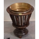 A 19th century stained beech slatted jardiniere stand, on bobbin turned supports,