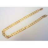 A gold neckchain, in a faceted openwork rectangular link design, on a sprung hook shaped clasp,