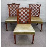 A set of three George III mahogany lattice back side chairs, on tapering square supports,