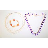 A fringe necklace, formed as a row of graduated amethyst briolette drops,